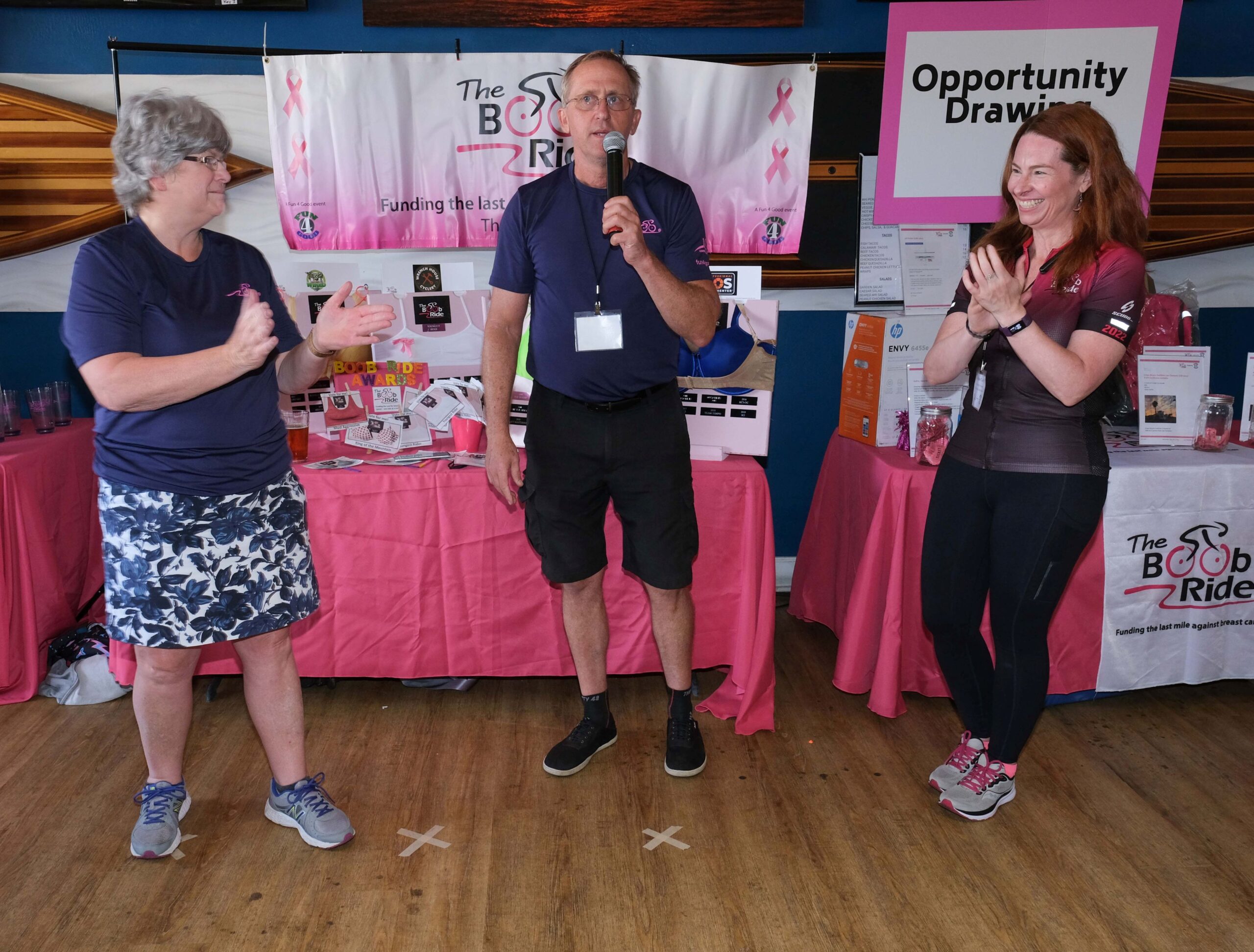 Three people on a stage