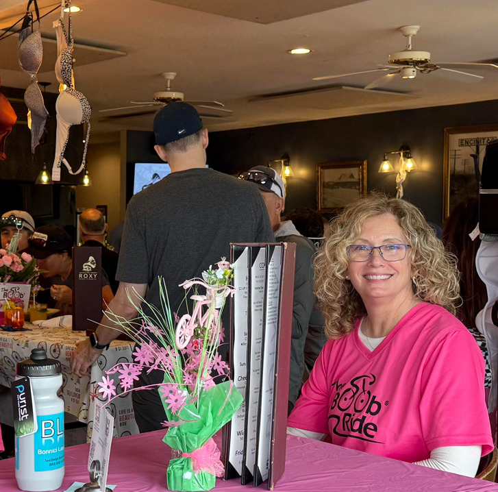 Woman in volunteer shirt at a party