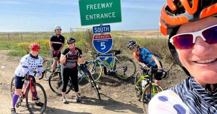 5 female cyclists around the 5 South sign